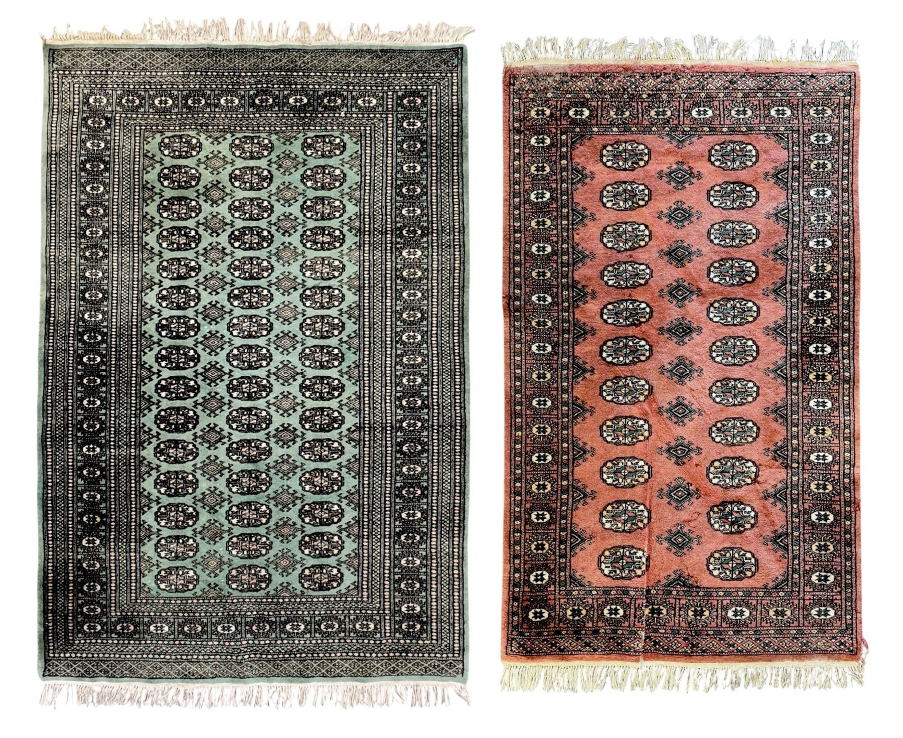 Pair of Pakistani Bokhara wool rugs one with green ground (L 187cm, W 124cm) and one with salmon pink ground (L 163cm, W  91cm) each with repeating Tekke gul motifs within multiple geometric borders both fringed to each end