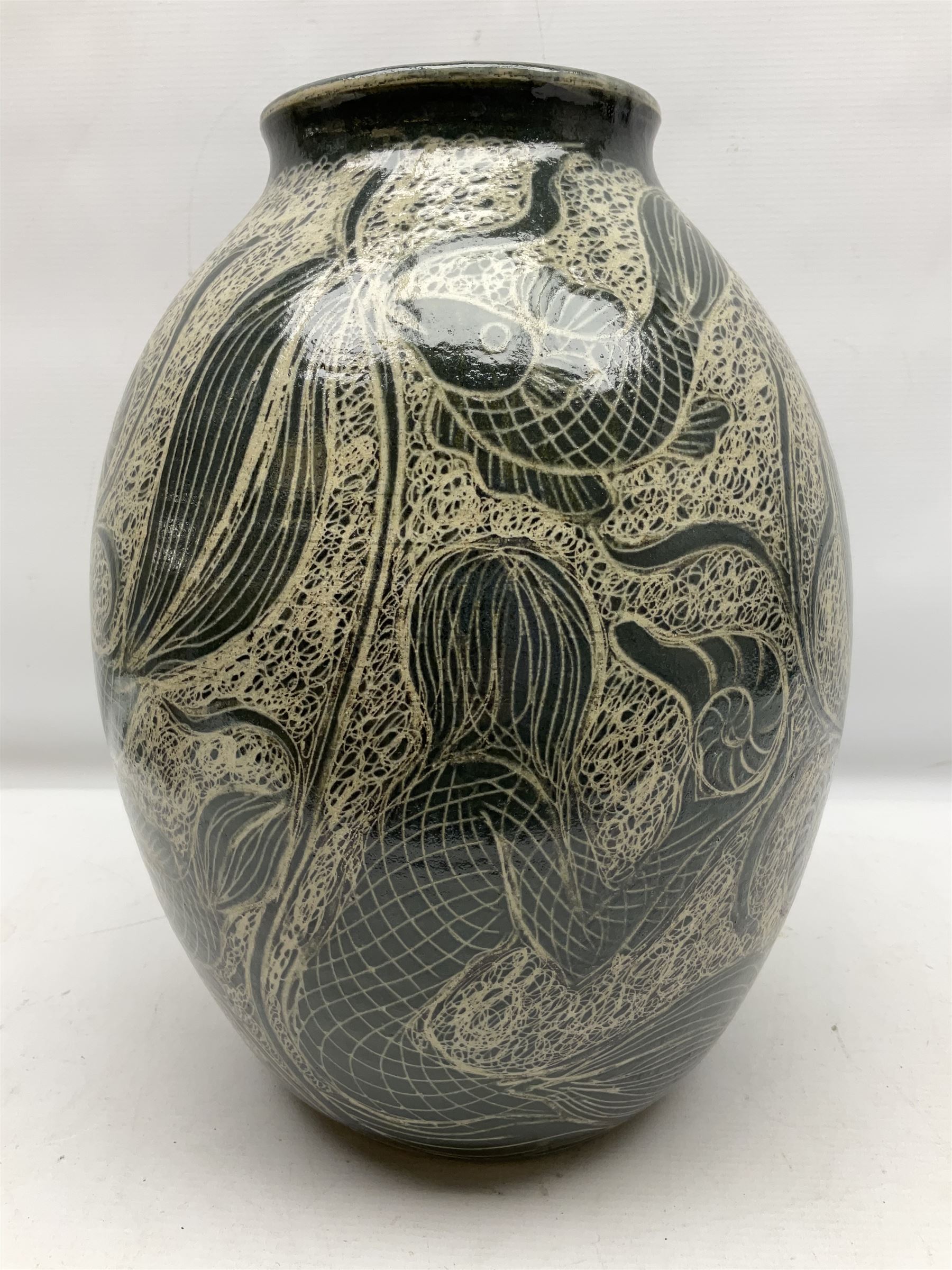 John Egerton (c1945-): studio pottery stoneware vase decorated with fish, mermaids and ammonites, H38cm