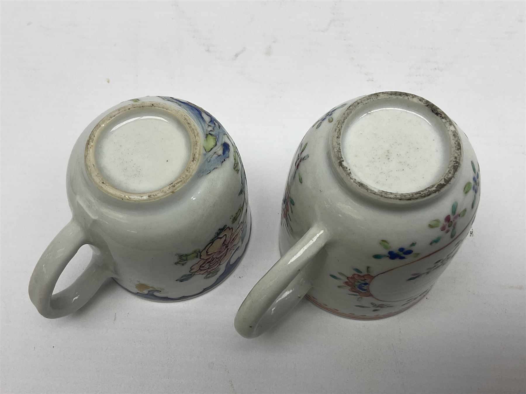 Two 18th century Chinese Yongzheng coffee cups, the first example decorated in polychrome enamel with rooster amidst blossoming peonies, the second decorated with deer and crane among rockwork and pine tree, together with two further 18th century Chinese coffee cups, an 18th century Chinese tea bowl, and a further tea bowl