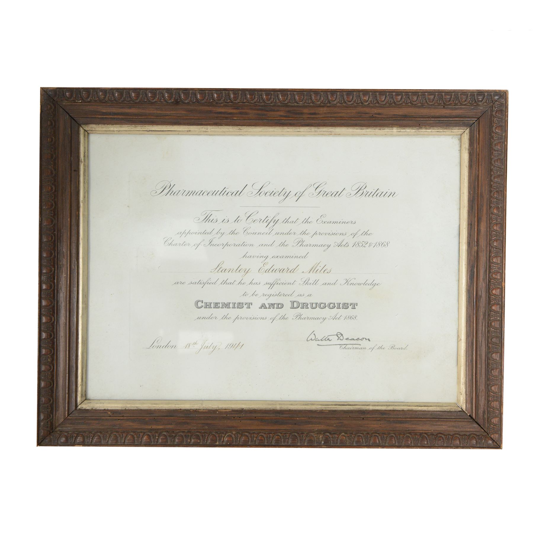 Carved birthing stool on three legs, together set of cased balance scales and framed certificate for Pharmaceutical Society of Great Britain 