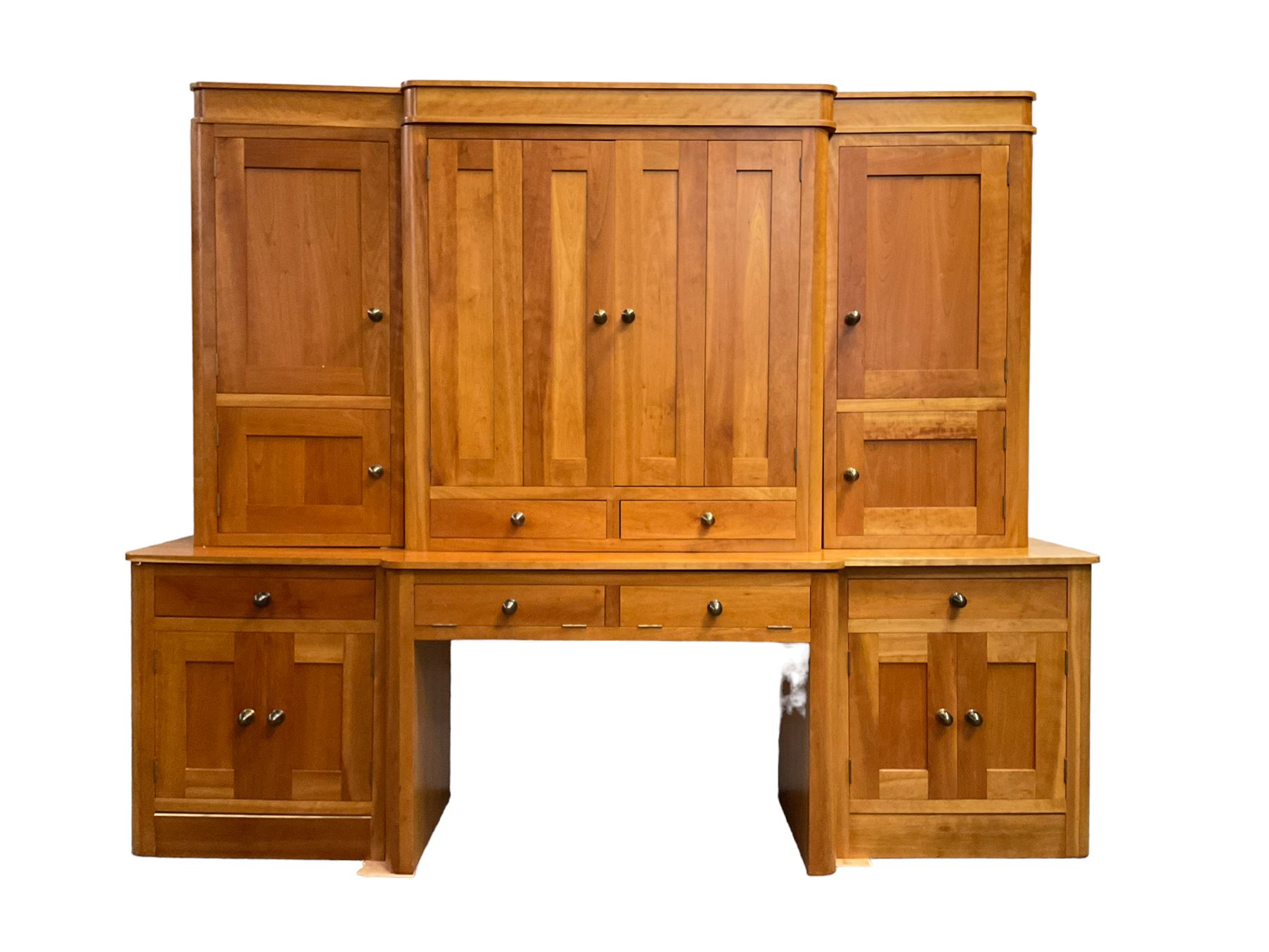 Large contemporary cherry wood break-front wall unit, the banded cornice over double cupboard with bifold doors and two drawers, flanked by four single cupboards, the base fitted with four drawers over four cupboards (W263cm, H216cm, D68cm); and a cherry wood cabinet, fitted with double cupboard over two short and two long drawers, with faux drawer facias (W81cm, H138cm, D66cm)