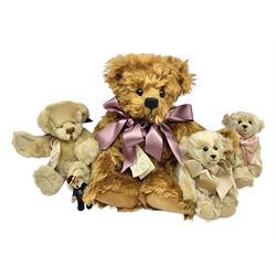 Group of five teddy bears comprising ‘George’ a unique pellet filled bear with glass eyes and velvet paws H38cm, and ‘Abbey’ a luxury German plush with wobble head and glass eyes no.5/10 H24cm, both with Teddies from Bearyland labels; along with two light blonde mohair H. M. Bears and Boyds Bears ‘T. F. Wuzzies’ no. 595140 (5)