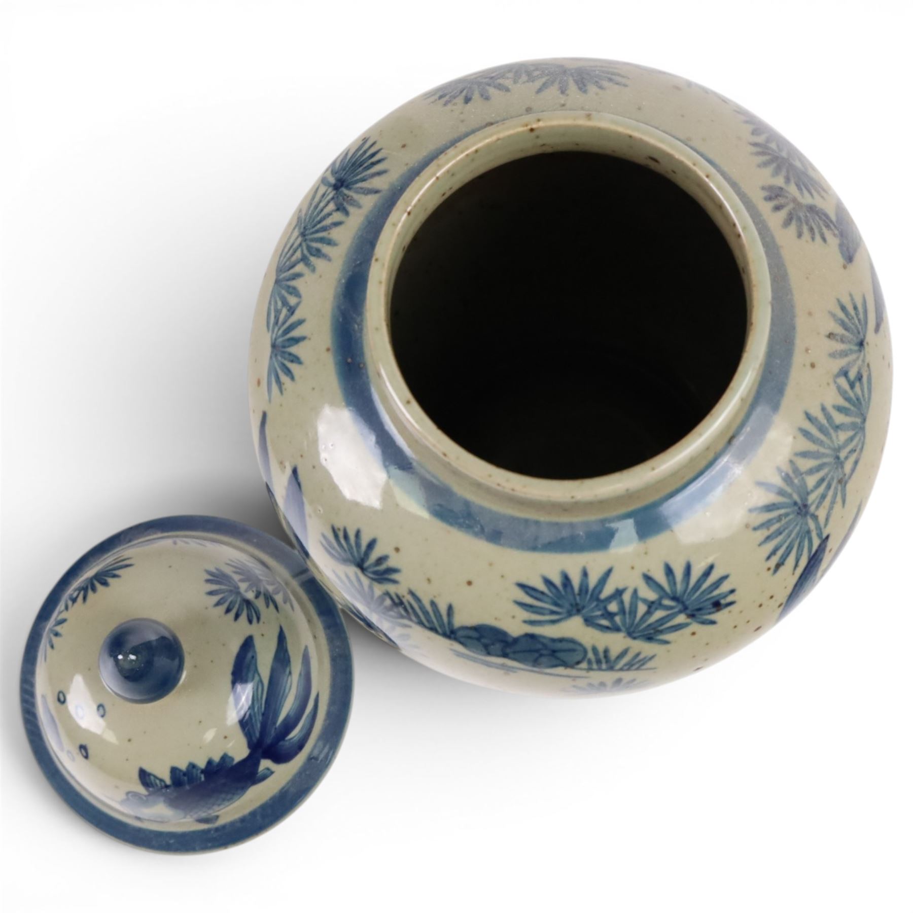 Pair of Chinese blue and white jars and covers, of baluster form, painted with fish and foliage H36cm