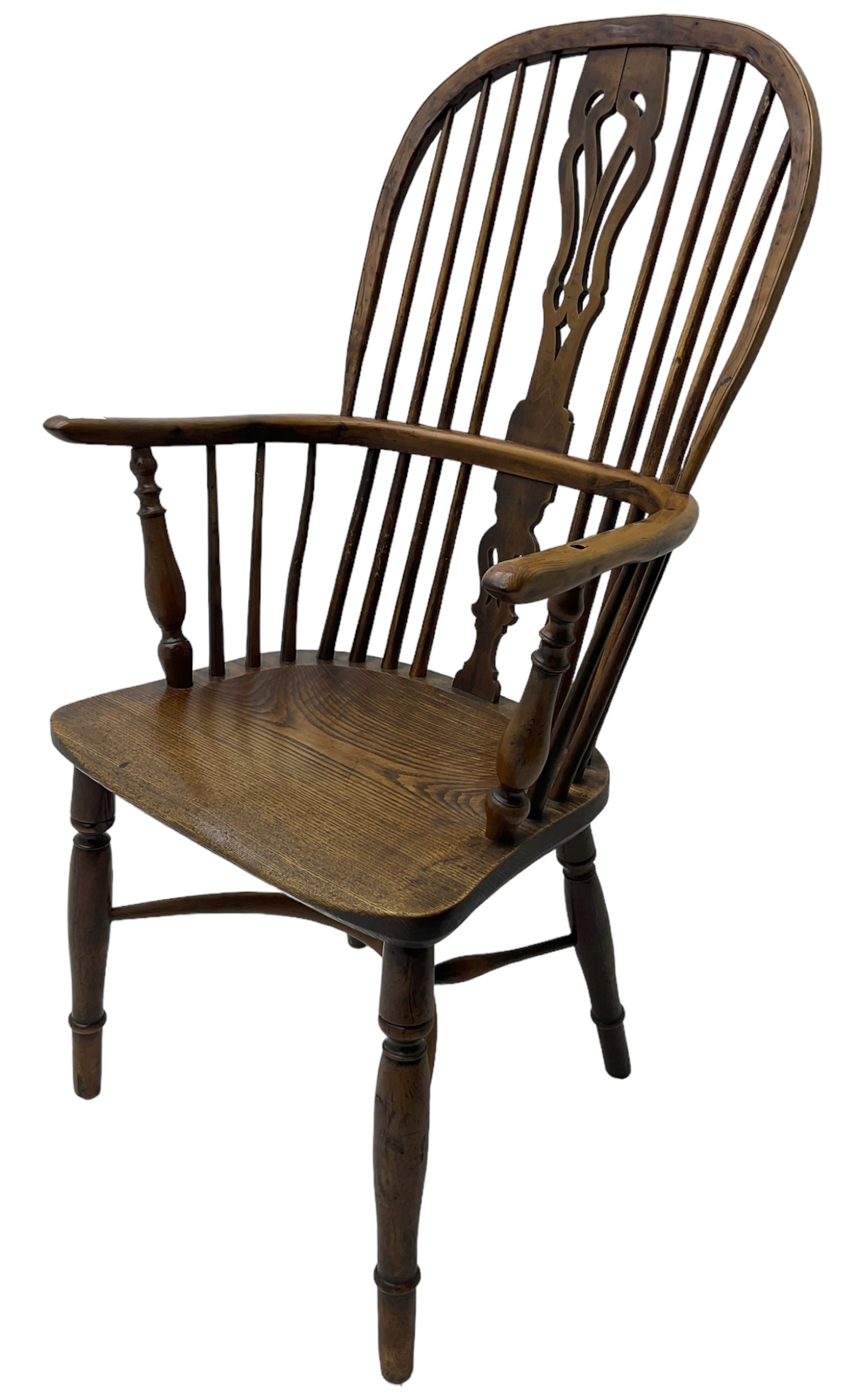 19th century yew wood and elm Windsor chair, high hoop and stick back with pierced splat over dished seat, raised on ring turned supports united by crinoline stretcher