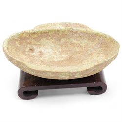 Two small Chinese terracotta 'ear' shaped wine cups, probably Western Han Dynasty c.206BC-24AD, one with green glaze, each on hardwood stand, W12cm (2)