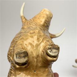 A Beswick Highland Bull, Highland Cow, and Highland Calf, each with printed mark beneath. 