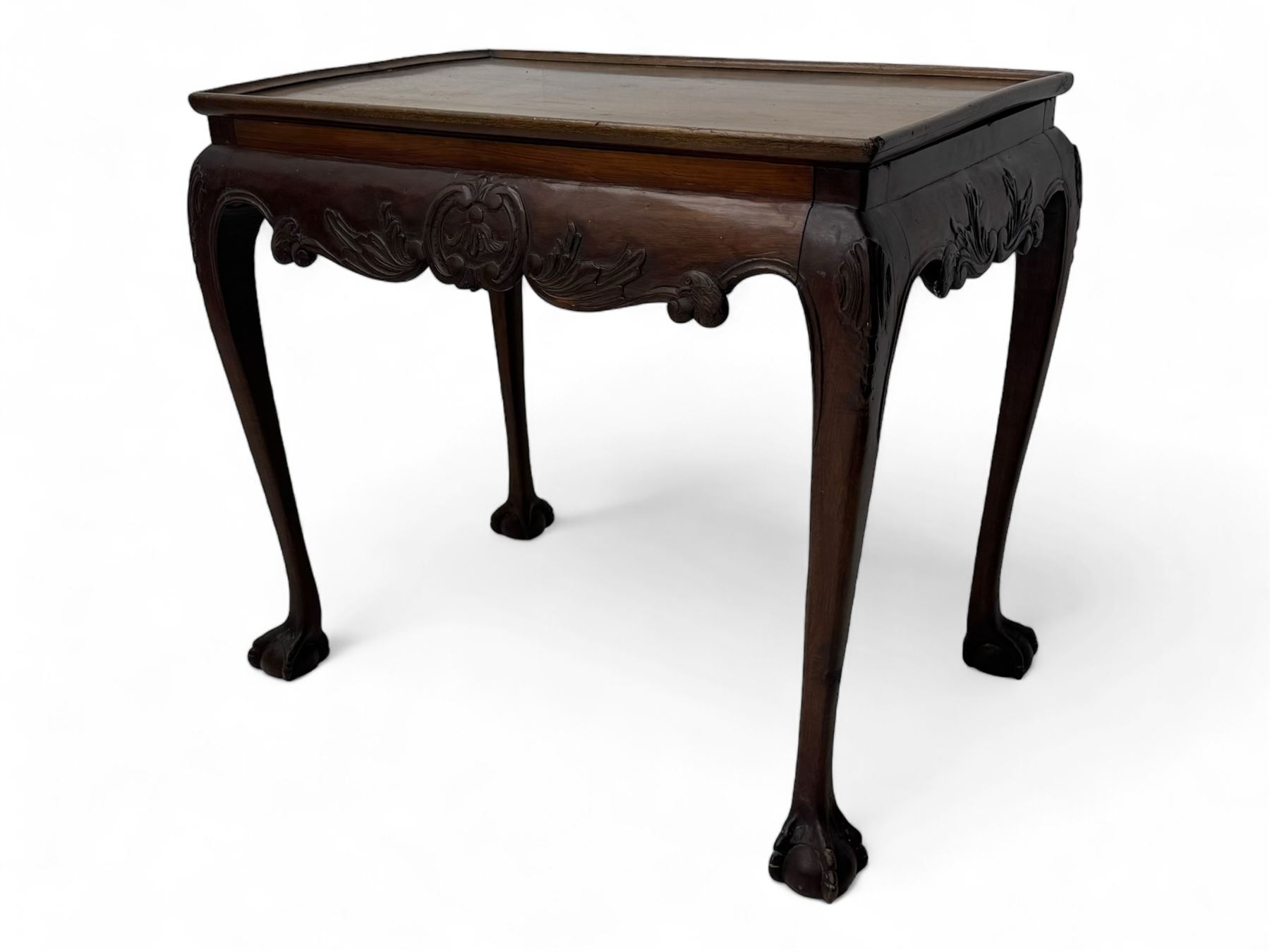 Late 19th to early 20th century mahogany side table, rectangular top with applied raised moulding, curved upper rails carved with C-scroll cartouches and extending curled leaves, bellflower carved cabriole supports with ball and claw feet 