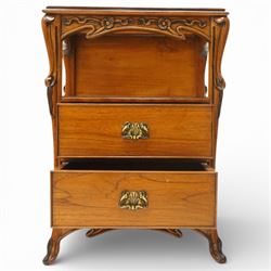 And So To Bed - pair of cherry wood and cane 'Libertine' bedside tables, glass top above a shaped and carved apron, with open recess above two drawers with brass handle, flanked by caned sides, raised on short cabriole supports 