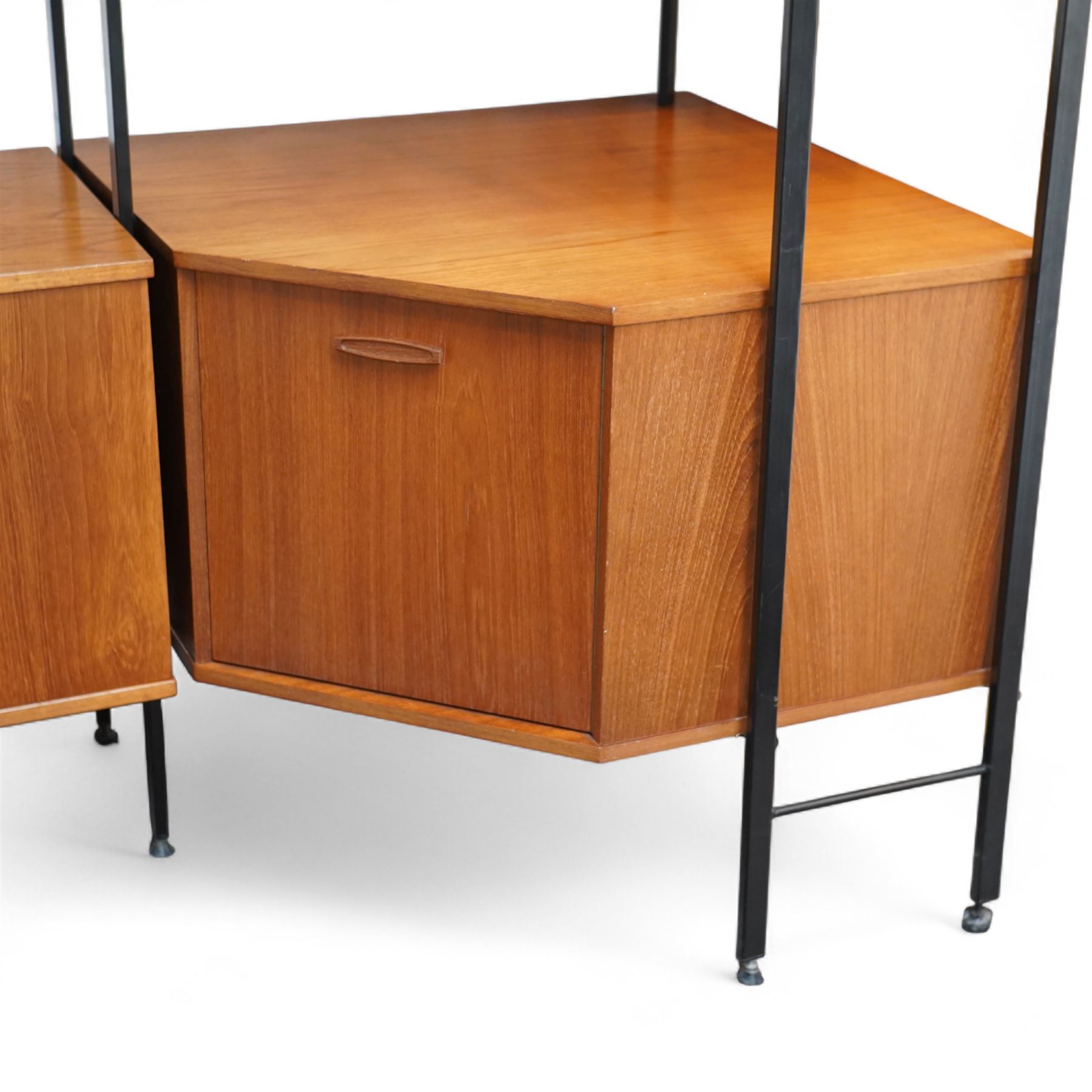 Avalon - modular teak wall unit, with black metal supports, fitted with cupboards, drawers, and adjustable shelves, corner configuration