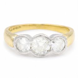 18ct gold gold and platinum diamond ring, bezel set with three old cut diamonds, Birmingha...