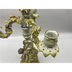 Dresden style candelabra, the central stem bordered by three branches, decorated with cherubs and yellow roses, H48cm