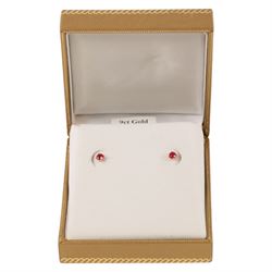 Pair of 9ct gold ruby stud earrings, boxed