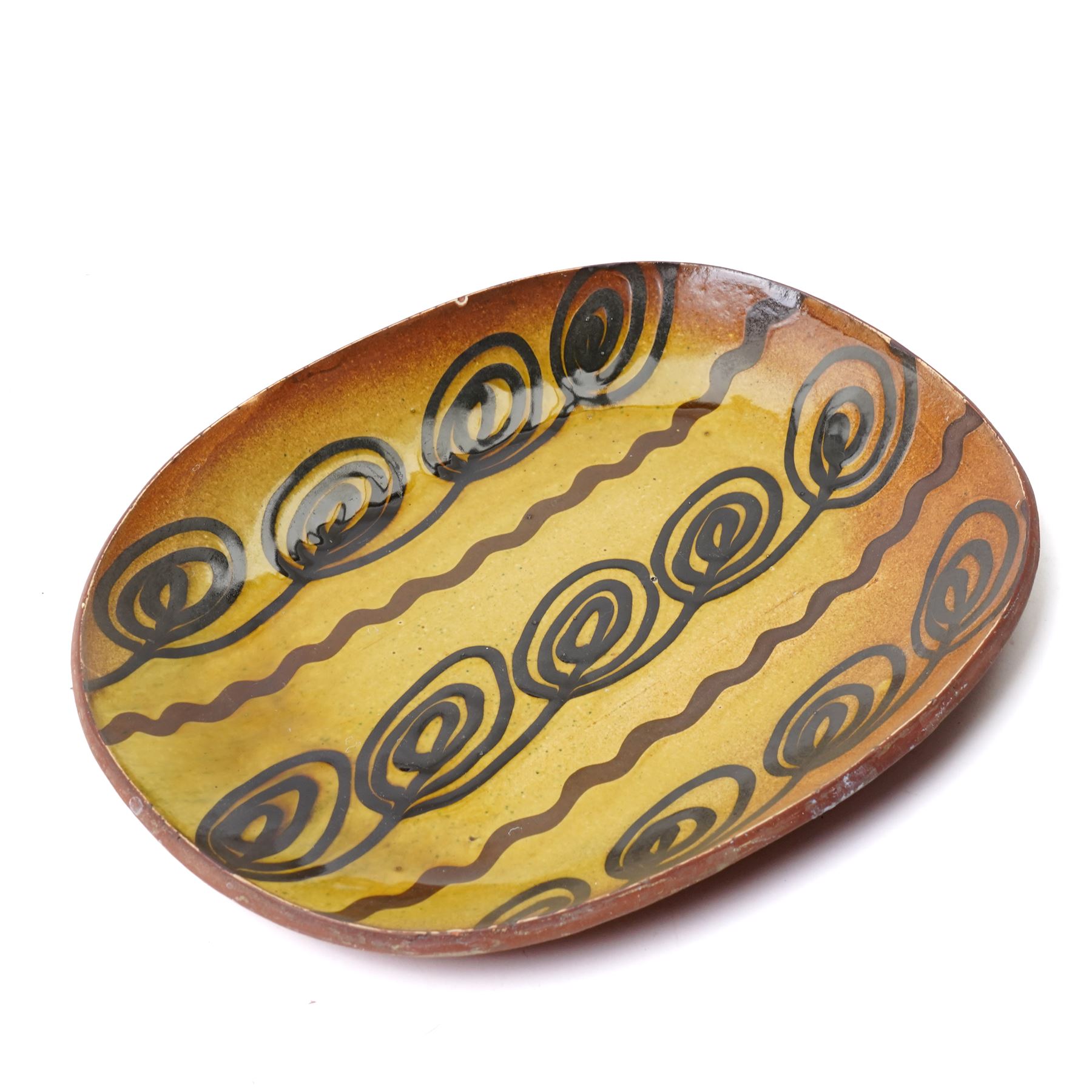 Mick Dixon studio pottery plate, decorate with an owl, impressed marks to base, D27cm; together with slipware dish, impressed BH initials to base, D32cm, a Poole pottery plate and a jug, H25cm (4)