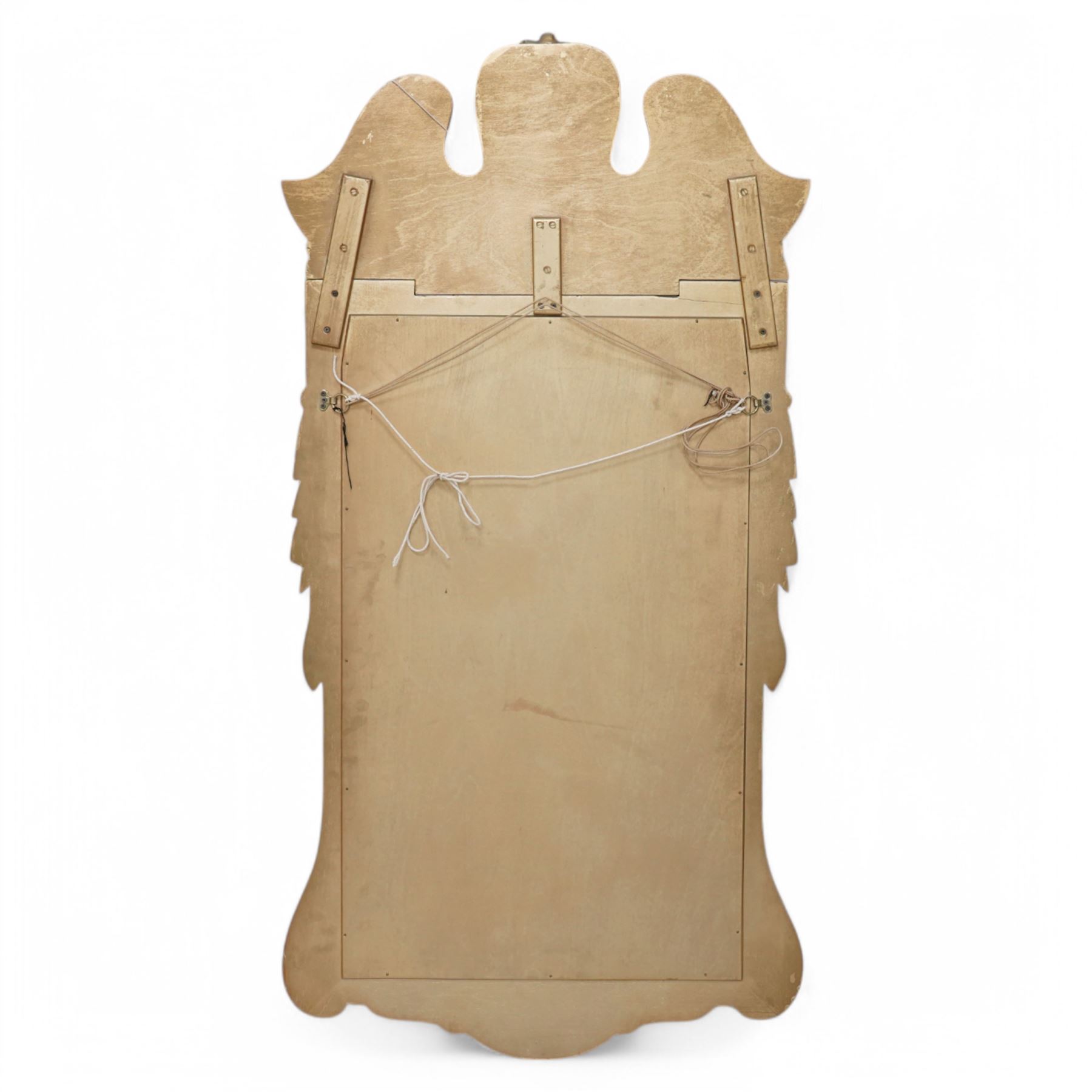 20th-century ornate gilt and mahogany Chippendale style wall mirror, the wooden gilt-edged frame with applied scrollwork with foliate motifs, drape, and tassel decoration 