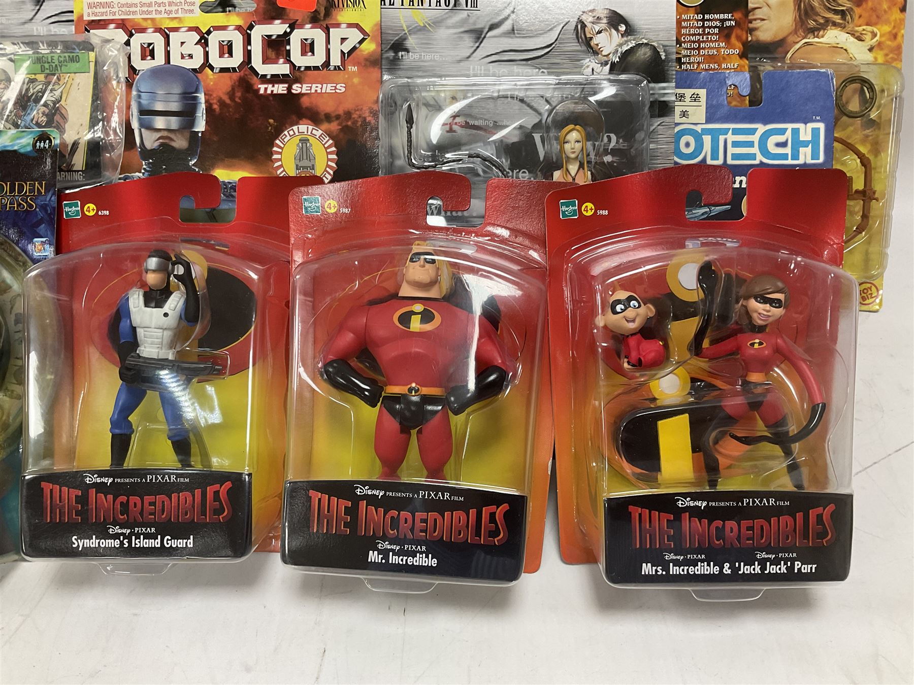 Twenty-three carded action figures including Fantasy VIII (6), Hercules (3), MIB (2), Robocop (2), The Golden Compass, The Incredibles (3), Wallace & Gromit (3), Robotech (2) and GI Joe; all in unopened blister packs (23)