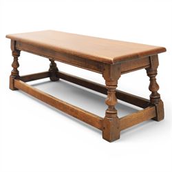 17th century style oak long joint stool, rectangular top with moulded edges, raised on turned supports united by stretchers