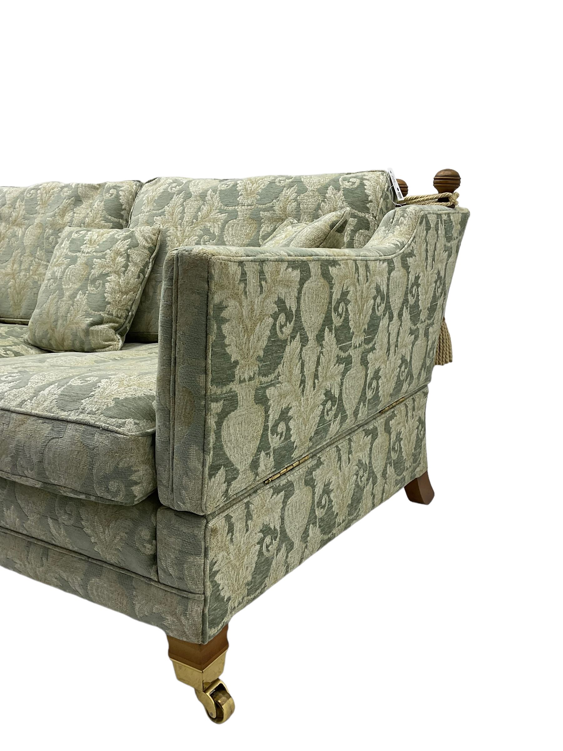 Three-piece hardwood-framed lounge suite - large two-seat Knole sofa with drop ends, upholstered in patterned fabric decorated with urns and foliage (W190cm, D117cm, H88cm); armchair upholstered in contrasting geometric pattern fabric (W83cm, D102cm, H93cm); and another armchair (W82cm, D102cm, H92cm) (3)