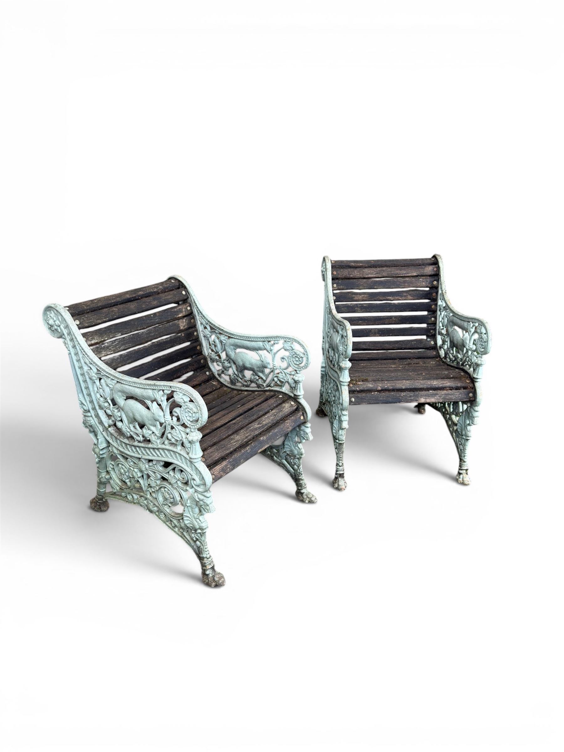 Pair of unusual Victorian revival heavy cast iron garden chair benches, ornate scrollwork detail with squirrels and nature, serpentine wood slatted seat and back - design by George Smith at the Sun Foundry, Glasgow