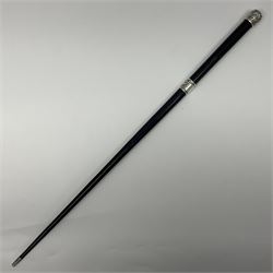 Two early 20th century conductor's ebonised batons each with three silver mounts; one hallmarked London 1915 with presentation plaque 'I.O.R. Presented to Mr. J.R. Maddock 4.1.17' L52cm; the other hallmarked Chester 1908 with vacant cartouche L51.5cm (2)