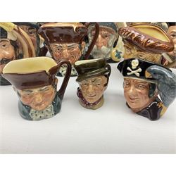 Large collection of Royal Doulton character jugs, to include Robinson Crusoe D6532, Tam O Shanter D6632, The Falconer D6533 etc, together with similar charater jugs and toby jugs   