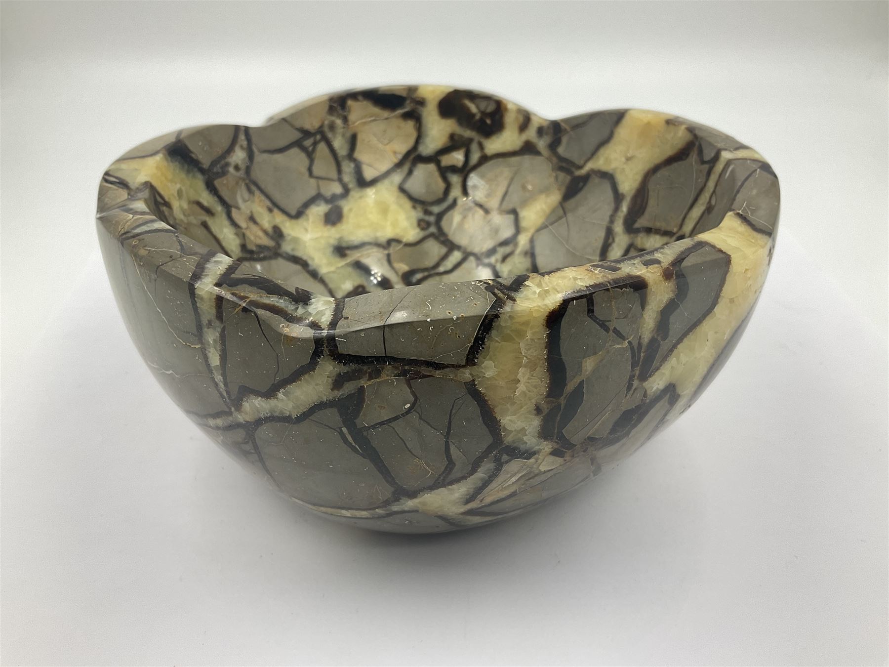 Polished septarian bowl, with a calcite and siderite within limestone rock, D16cm H8cm