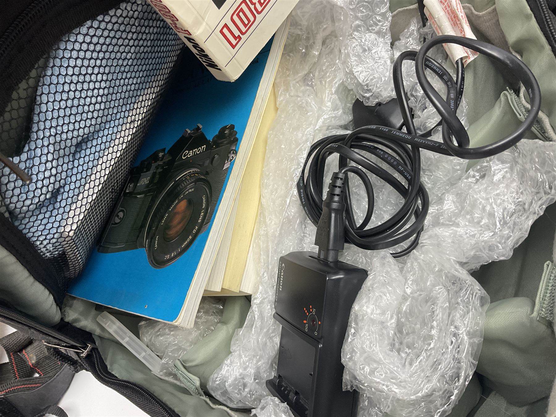 Four camera bodies, to include, Ricoh KR-10 serial no. 38826, Pentax MZ-M serial no. 4185969 with 'SMC Pentax- M 1:3.5 28mm' lens, Canon EOS500 serial no. 080927, with 'Sigma Zoom 100-300mm 1:4.5-6.7 DL'  lens etc, with other camera lenses and equipment 