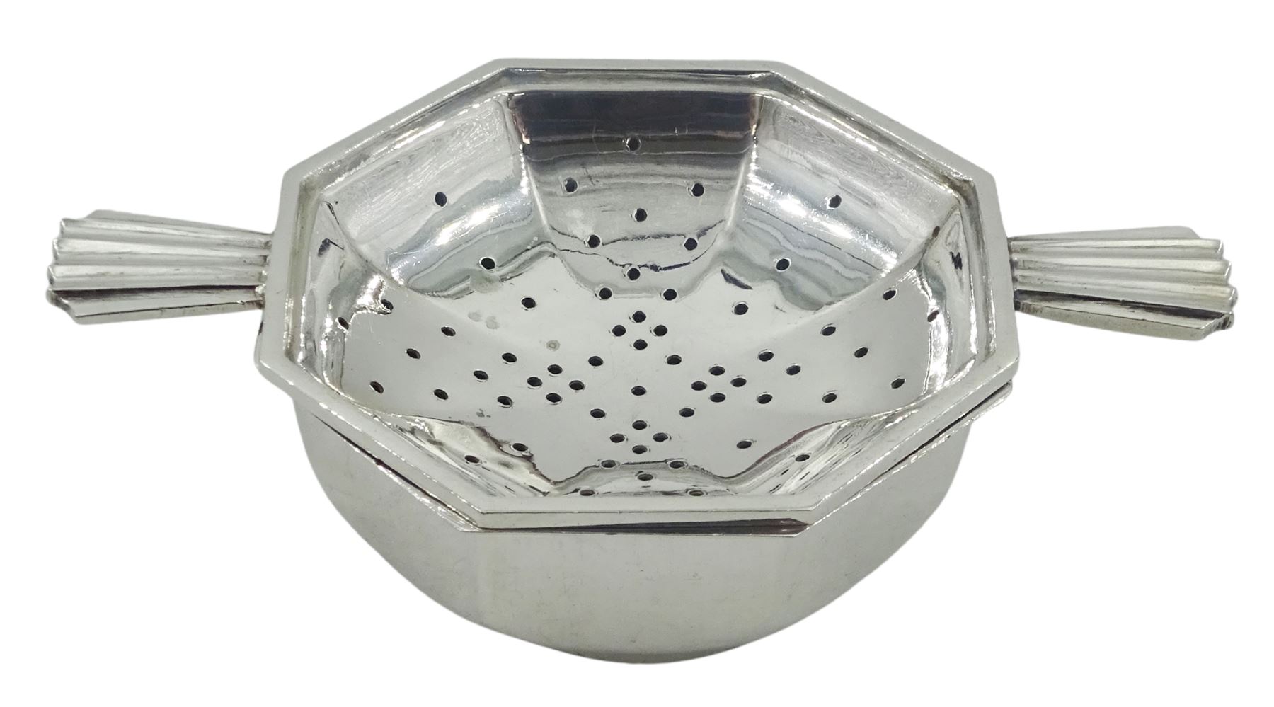Mid 20th century silver tea strainer and bowl, each of octagonal form