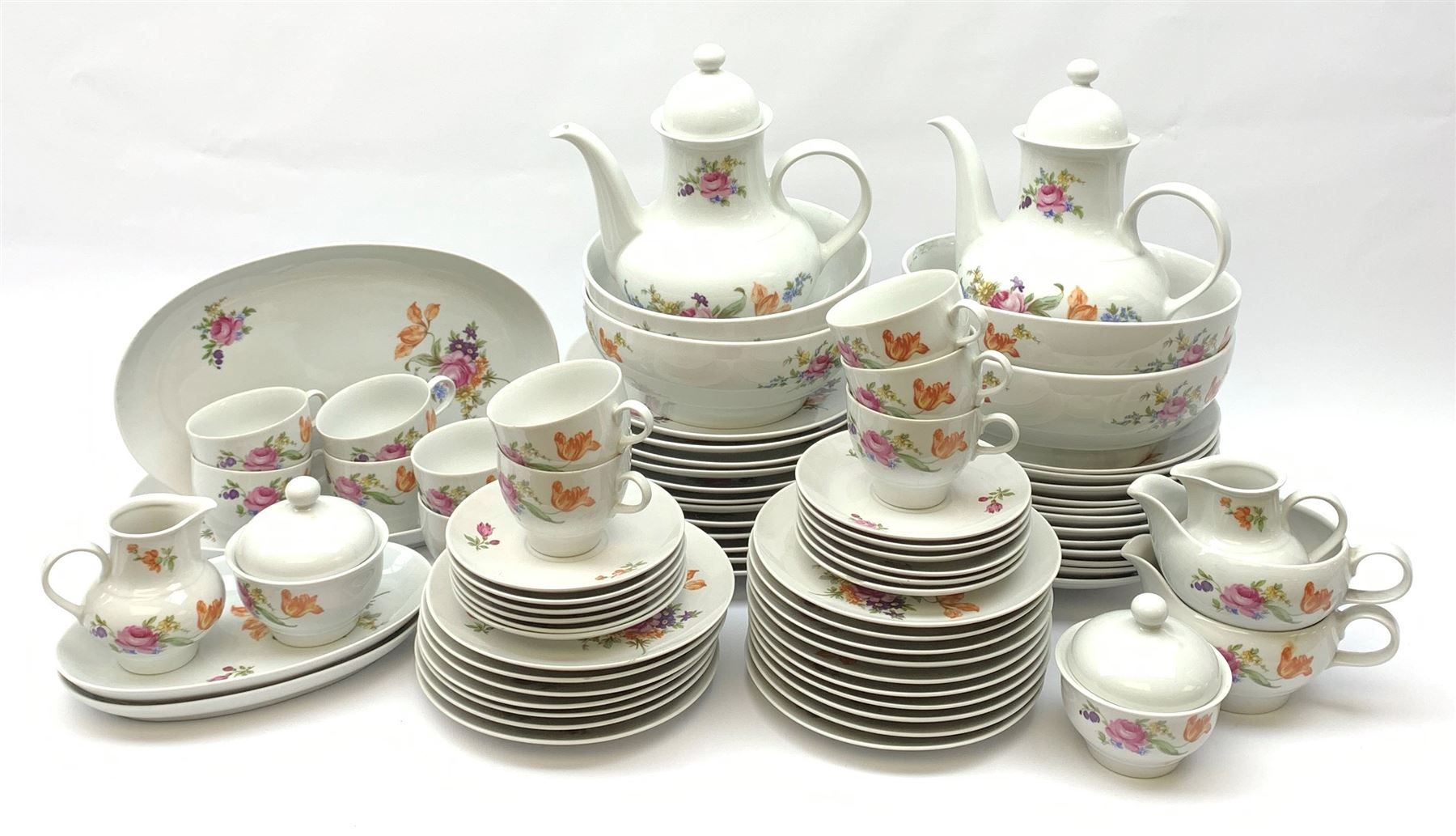 JLmenau German tea and dinner wares, comprising twelve dinner plates, seventeen side plates, twelve bowls, four large serving bowls, pair of oval serving platters, pair of smaller examples, two coffee pots, eleven teacups, twelve saucers, two milk jugs, two larger jugs, and two lidded sucriers. 