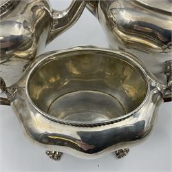 Five piece Edwardian silver tea service, comprising teapot and coffee pot, each with ebonised scroll handle, tea caddy with hinged cover, twin handled open sucrier, and milk jug, each of rounded bombe form, upon four paw feet, hallmarked William Adams Ltd, Birmingham 1904 and 1905, coffee pot H26cm

