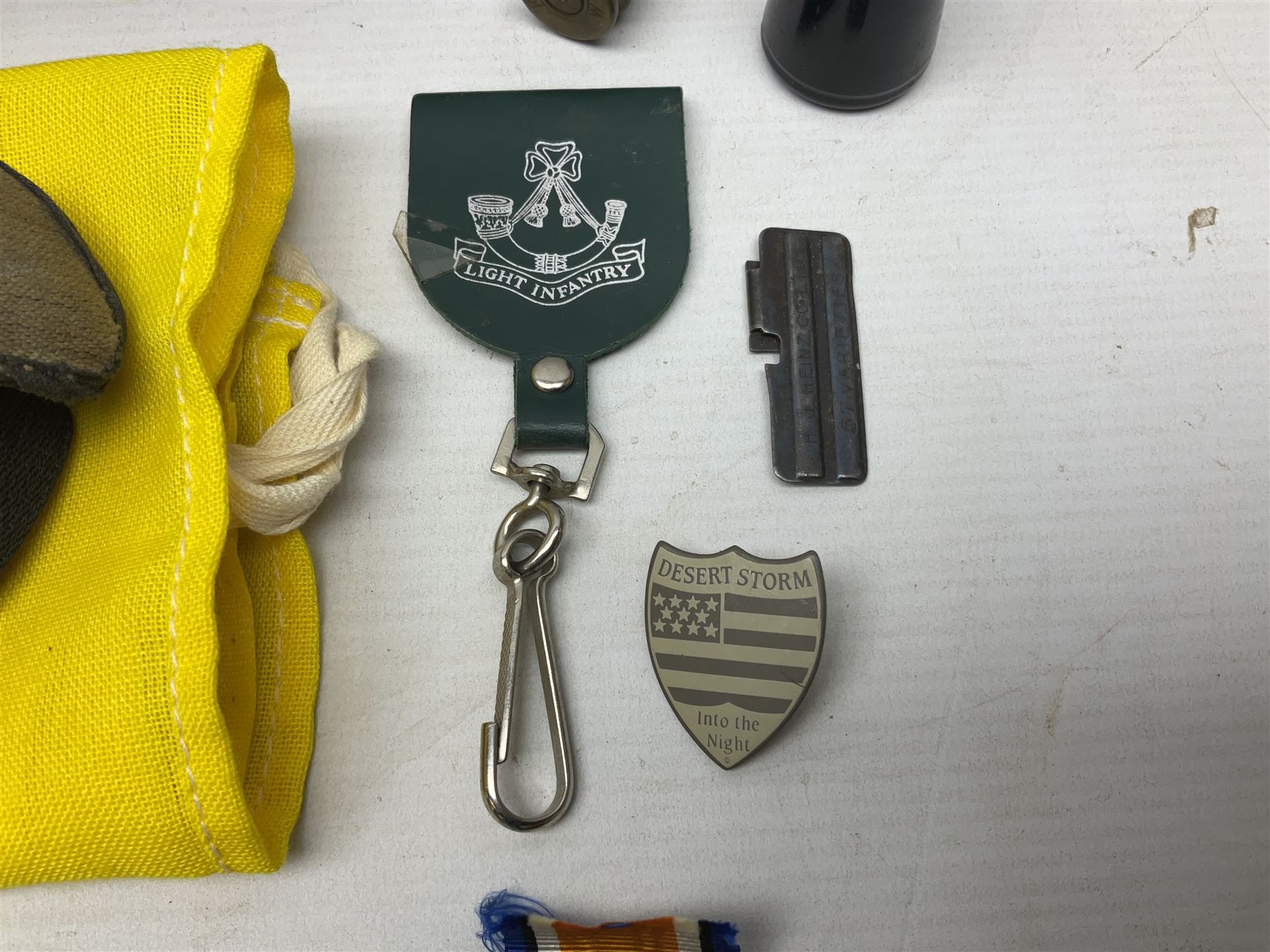 Miscellaneous militaria including two Royal Artillery and one Royal Horse Artillery stable belts; Northamptonshire Regiment trench art brass shell case lighter; unused Matchless Fire-Set; pocket knives and multi-tool; lanyards; oak shield with York & Lancaster crest etc