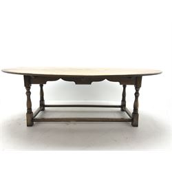 17th century style oval distressed light oak plank top dining table, rectangular stretcher base, L228cm, W150cm, H77cm