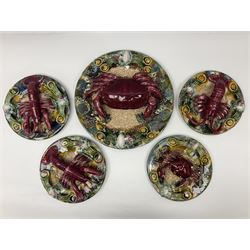 Five 20th Century Portuguese Palissy style Majolica wall plates, all depicting crustaceans to the centre modelled in relief surrounded by encrustations and shells, both with impress marks beneath, largest D29cm