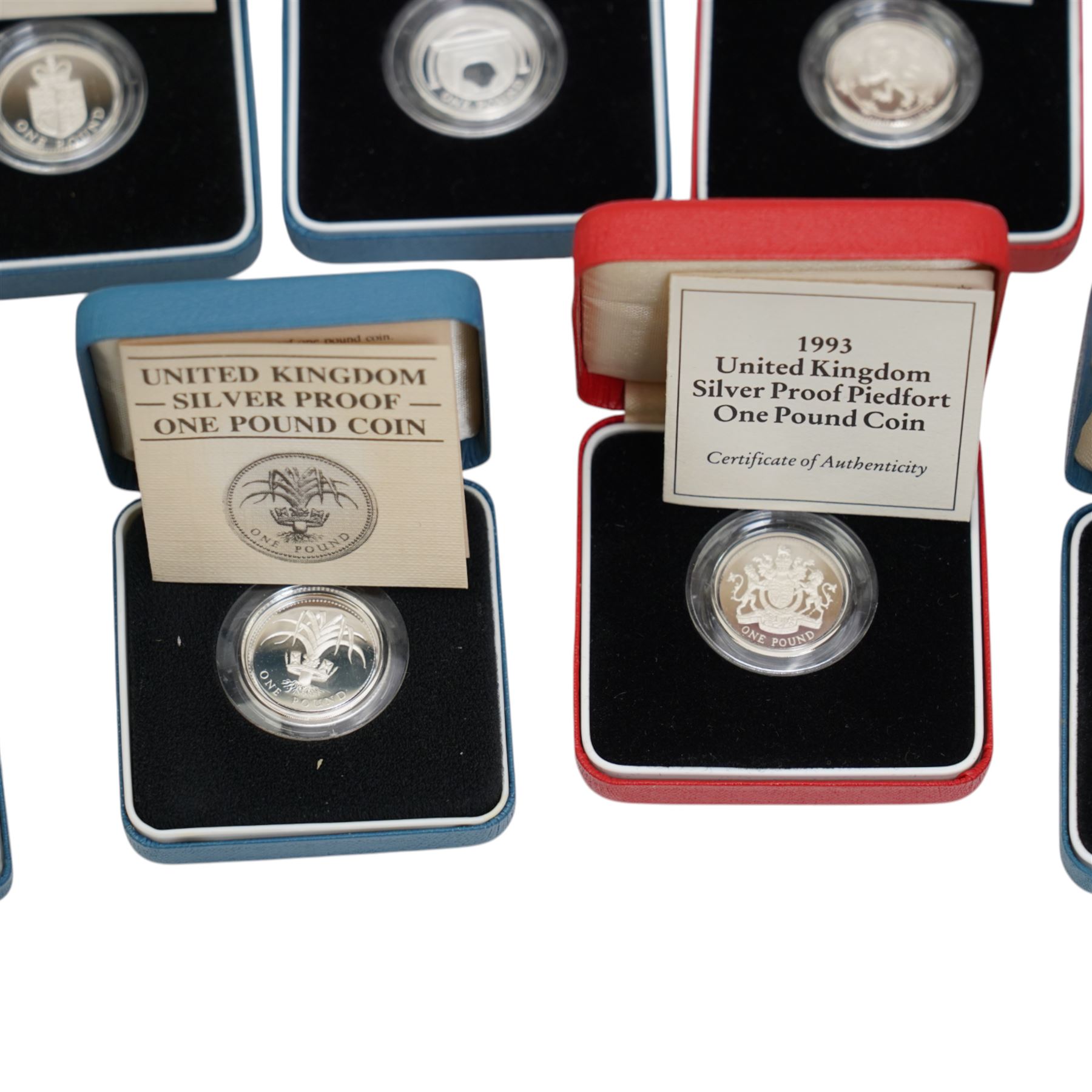 Thirteen The Royal Mint United Kingdom silver proof one pound coins, comprising 1983-1989, 1993 piedfort, 1994, 1994 piedfort, 1997, 2004, and 2006, all cased with certificates
