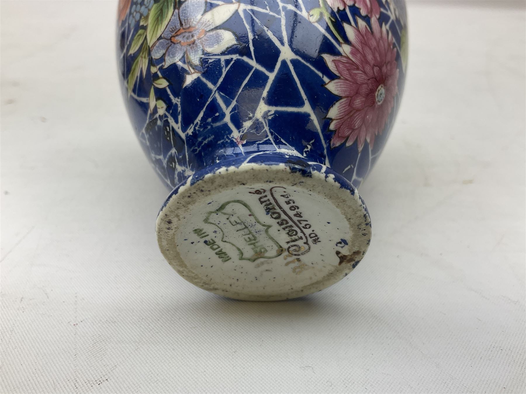 Shelley Cloisonne pattern vase, Carlton Ware Rouge Royal pattern twin handed dish and ash tray decorated with pagoda and Poole Delphis shallow bowl with geometric decoration on orange ground, largest L28cm