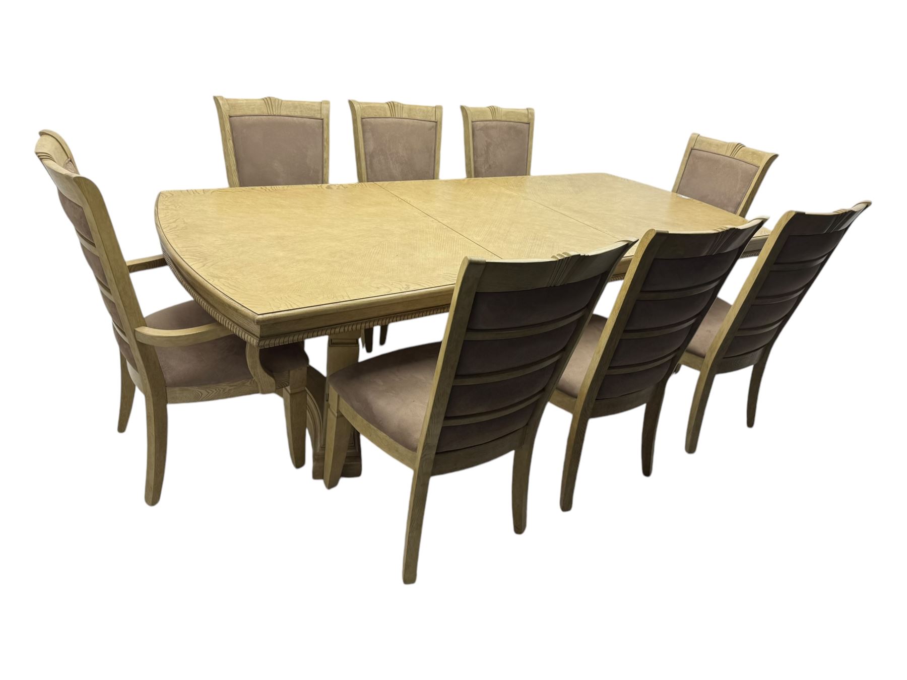 Brunswick - washed oak finish extending dining table, rectangular top with curved ends and carved frieze, central extension leaf, raised on twin pedestals with arched plinth bases and square-sectioned column supports; set of eight (6+2) high-back dining chairs upholstered in beige velvet fabric