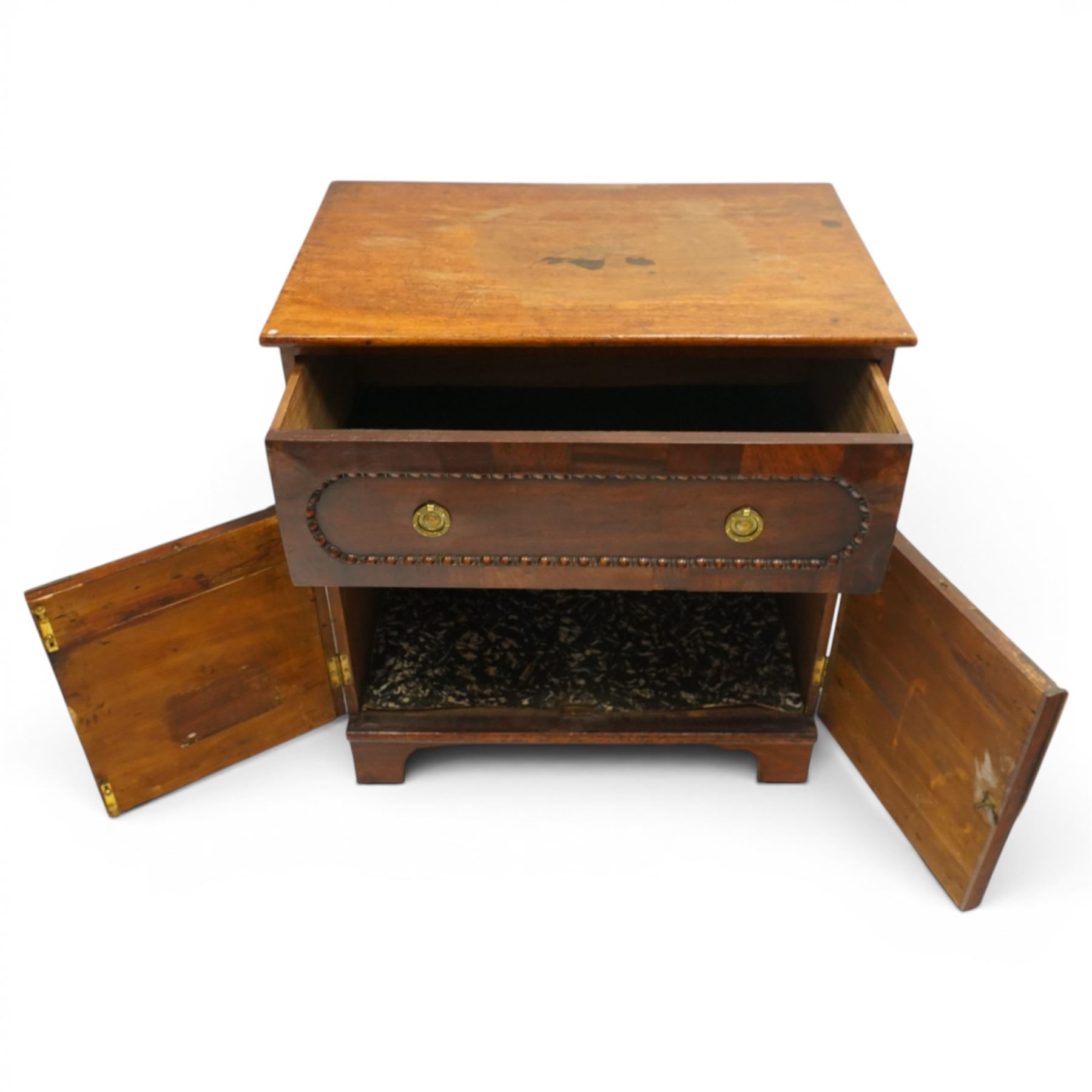 George III mahogany converted commode cabinet, rectangular top over single drawer with egg-and-dart moulding, over two arched panelled cupboard doors, on bracket feet