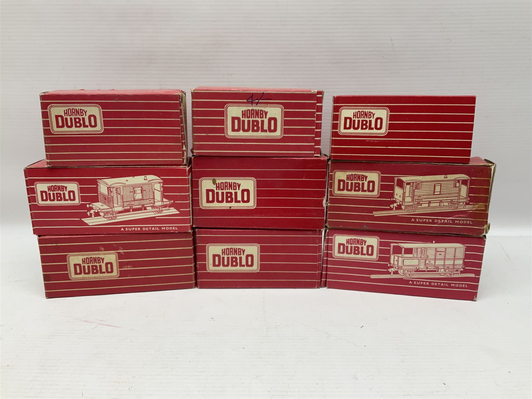 Hornby Dublo - sixteen goods wagons comprising 4644 21-Ton Hopper Wagon, 4315 Horse Box (BR) with horse, 4316 Horse Box (SR) with horse, 4649 Low Sided Wagon with tractor, 4301, 4310, 4311, 4312, 4313, 4320, 4626, 4648, 4652, 4675, 4678 and B550200 (Mineral Wagon); all in red boxes (16)