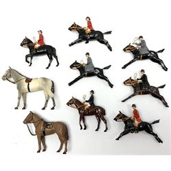Seven Britains lead figures of huntsmen and women on horseback either standing or cantering; and two other horses without riders (9)