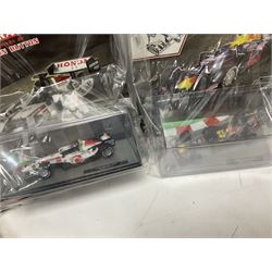 Panini Formula 1 The Car Collection - twelve die-cast models including ten in unopened packaging with periodical; all models in plastic display boxes; and eight other boxed die-cast models of racing cars by Corgi, Onyx, Classico, Minichamps etc (20)