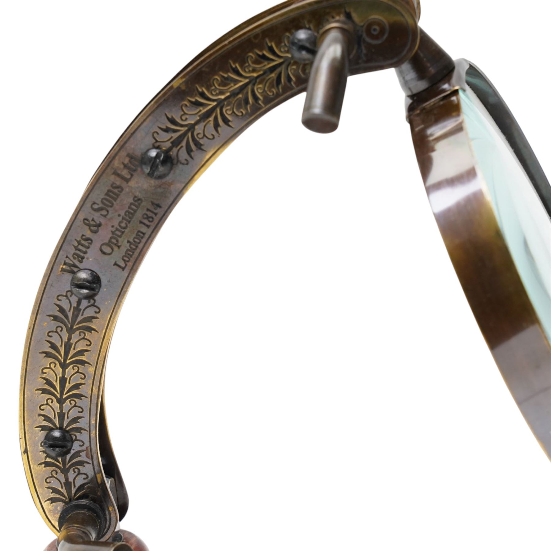 Magnifying glass on wooden stand