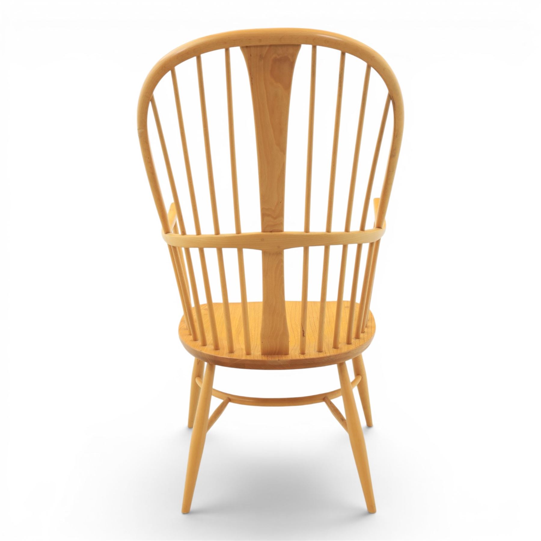 Ercol - Windsor 'Chairmakers' light ash armchair, with traditional spindle backrest, above a dished seat, with cylindrical supports united by a carolean stretcher