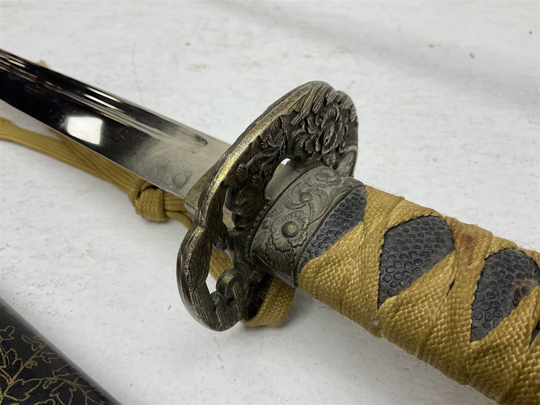Reproduction Japanese katana with 63cm slightly curving fullered steel blade, ornate tsuba, cord bound grip and gilt transferred black saya L92cm; and two fencing foils, one marked Leon Paul (3)