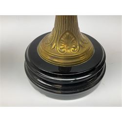 Victorian table standing oil lamp, brass fittings, cranberry glass reservoir, brass column on black enamelled ceramic base, with a frosted glass shade and clear glass chimney, H68cm