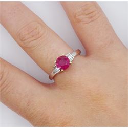 18ct white gold round cut ruby ring, with two baguette cut diamonds set either side, stamped 750, ruby approx 0.80 carat