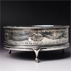 George III silver circular stand, originally a cruet stand, with pieced rim decorated with garlands and swags with turned wood base on claw and ball feet D14cm