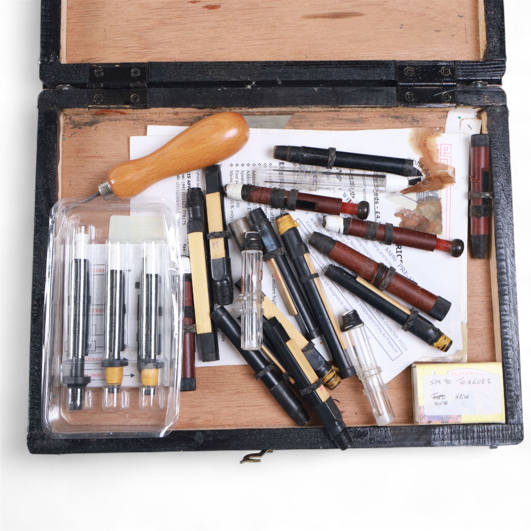 Set of late 20th century silver mounted bagpipes, the turned ebonised hardwood drone rods with Celtic knot and stipple engraved silver collars and ivorine mounts, hallmarked Bernie Leigh, Birmingham 1991, with R.G Hardie Glasgow plastic chanter and bag in green and blue Armstrong tartan, contained within a plush lined hard case, with a collection of spare reeds, drone rods, chanter, bags, cleaning accessories and other accessories 