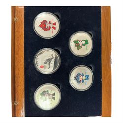 Mostly commemorative coins, medallions and fantasy coinage, including various 'Sainsbury's Makers of the Millennium' medal collection folders containing various medallions, The Toer Mint commemorative four medallion set in fitted case, Queen Elizabeth II 1982 silver proof piedfort twenty pence coin cased with certificate, various part filled The London Mint office folders etc
