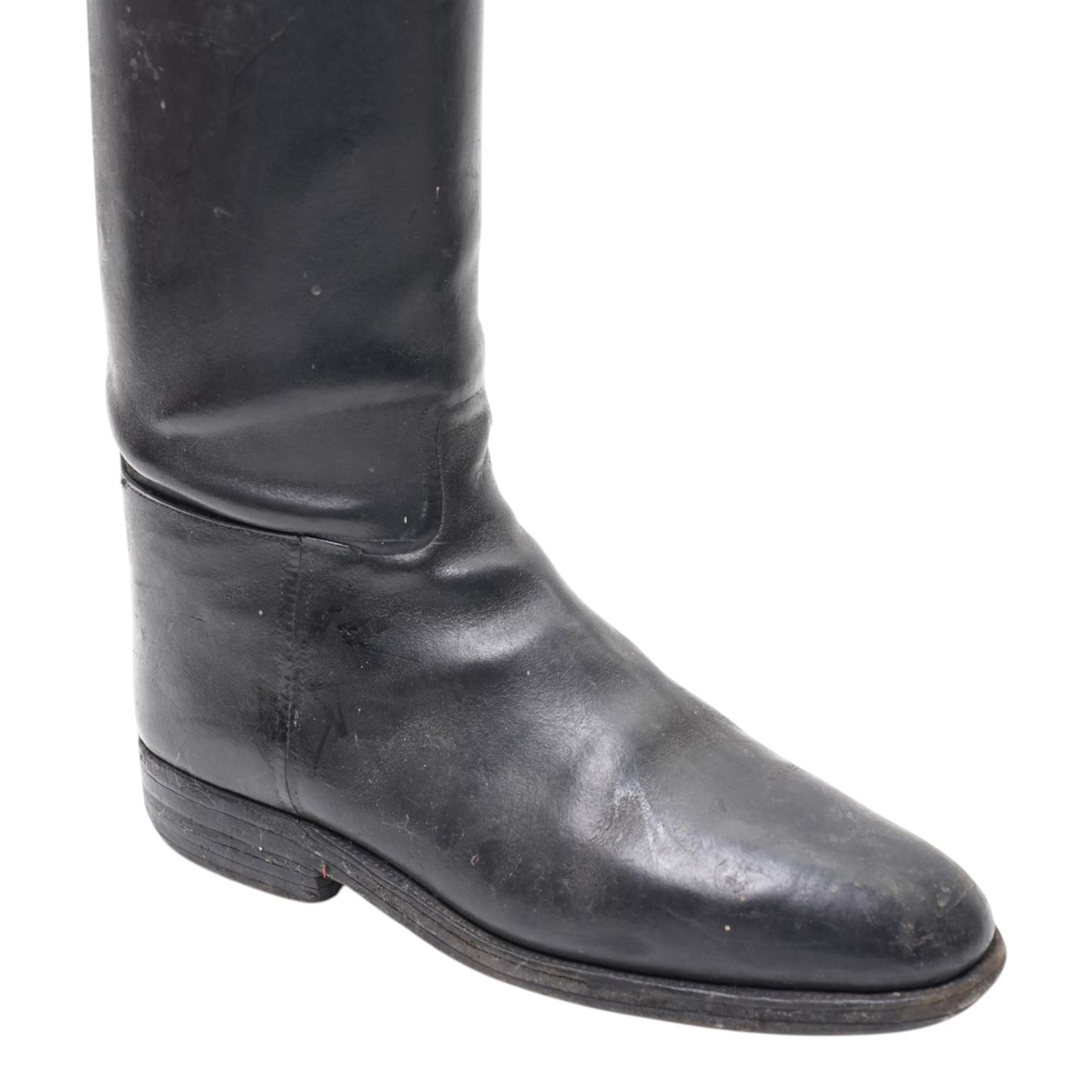 Two pairs of leather riding boots with wooden trees