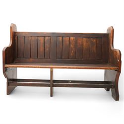 Victorian pine pew or bench, panelled back with book raised over plank seat, on shaped end supports united by stretcher 