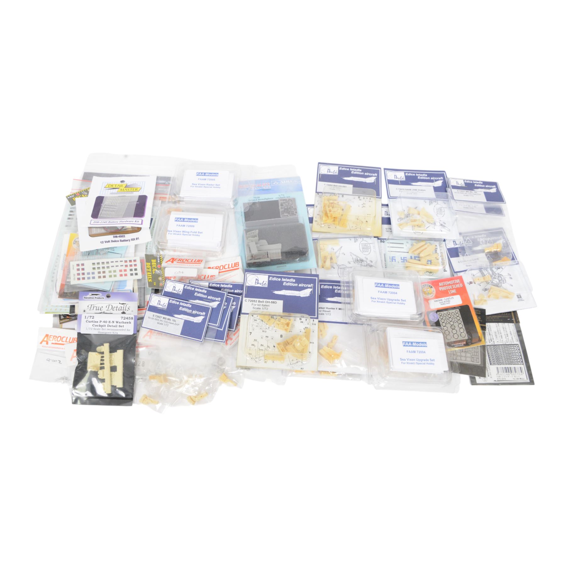 Scale modelling detailing accessories, predominantly for aircraft modelling, including masking sheets, metal parts, white metal weapons, moulded seats, decals, etc all within packaging